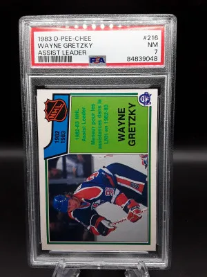 1983 OPC HOCKEY 216 WAYNE GRETZKY ASSIST LEADER PSA 7 NR MINT front